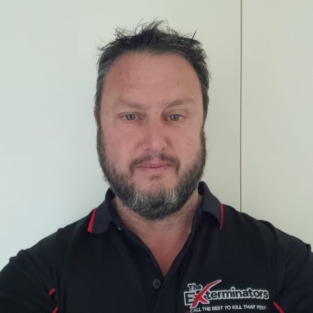 profile picture of Rob the Owner Of The Exterminators pest control & termite inspection company in Wentworth Point NSW wearing his work uniform with logo The Exterminators, slogan call the best to kill that pest